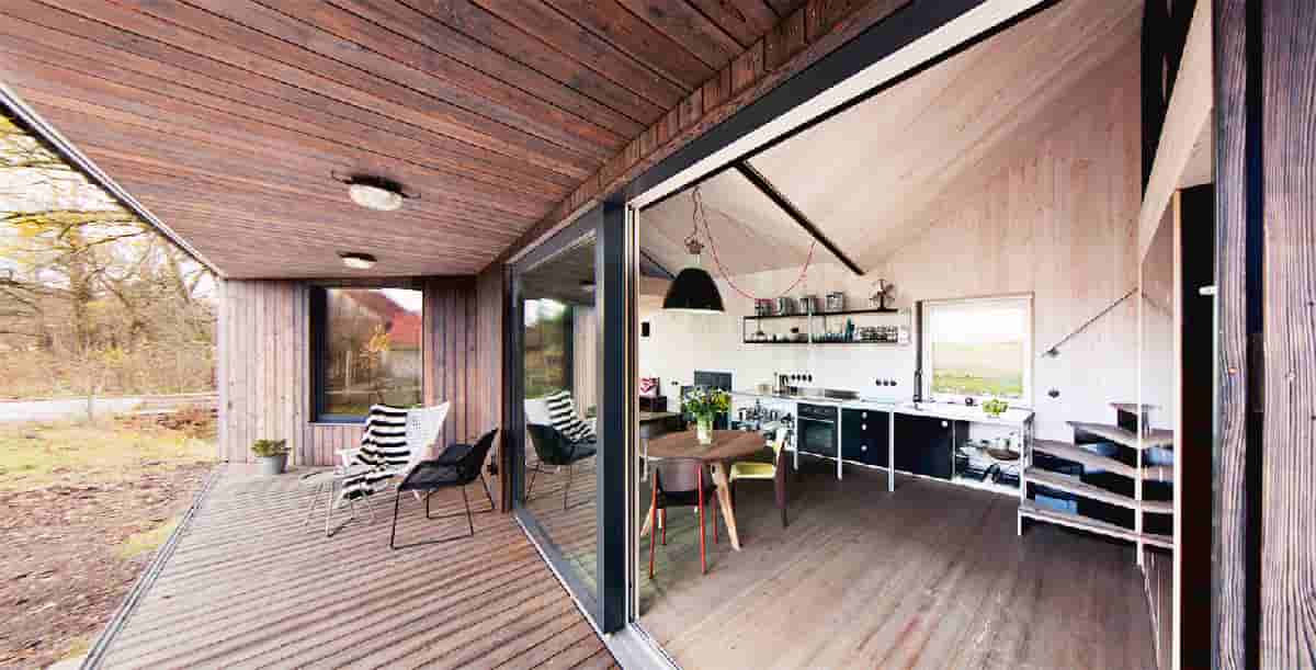 Design an open-plan, low-energy wooden house to improve the closeness of the family
