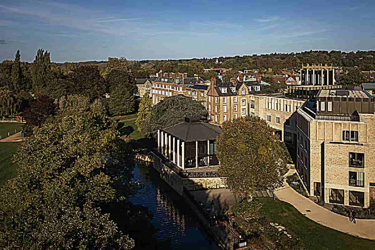 1) Include a new entrance sequence, Anniversary Building and Pavilion, all set in a reimagined landscape. The Anniversary Building defines the boundary of the College, strengthens the street scene on Cowley Place. [The campus of St Hilda's College in Oxford has been redesigned to convey the architectural art of rapper's new face]. [Creates enclosure the tranquil gardens, within College hilst the Pavilion nestles on edge of River Cherwell within this verdant riverside setting]; [St Hilda's College Oxford Is The Architectural Rapper's Art Of New Looking Fly].