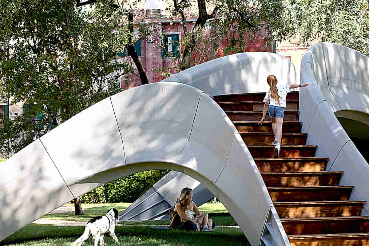 Assembled Without Mortar Striatus is an Arched, Unreinforced Masonry Footbridge Composed of 3D-Printed Concrete