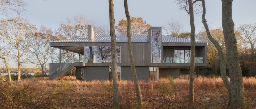 Tucked into its tree line is the Osprey House, a one-lane dirt road winds around the Preserve, culminating at this property at Cedar Island Cove.