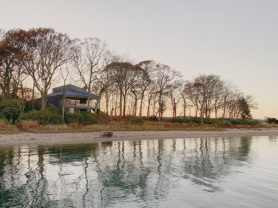 Tucked into its tree line is the Osprey House, a one-lane dirt road winds around the Preserve, culminating at this property at Cedar Island Cove.