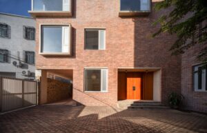 brick house light well interior with vertical light and shadow