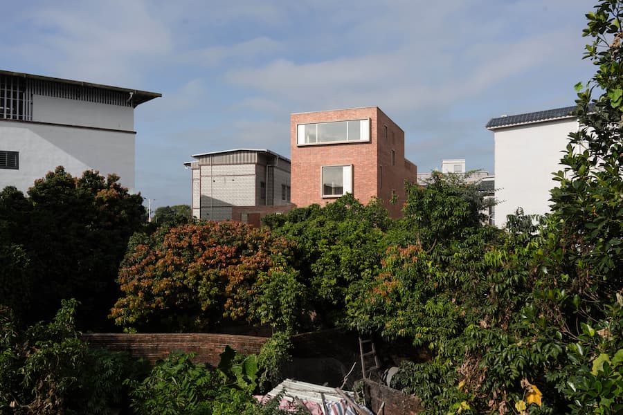 overall volume of brick house within village setting 