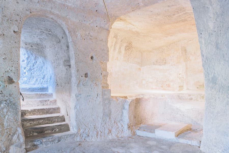 subsurface architecture carved into earth showing early human excavation and material extraction space