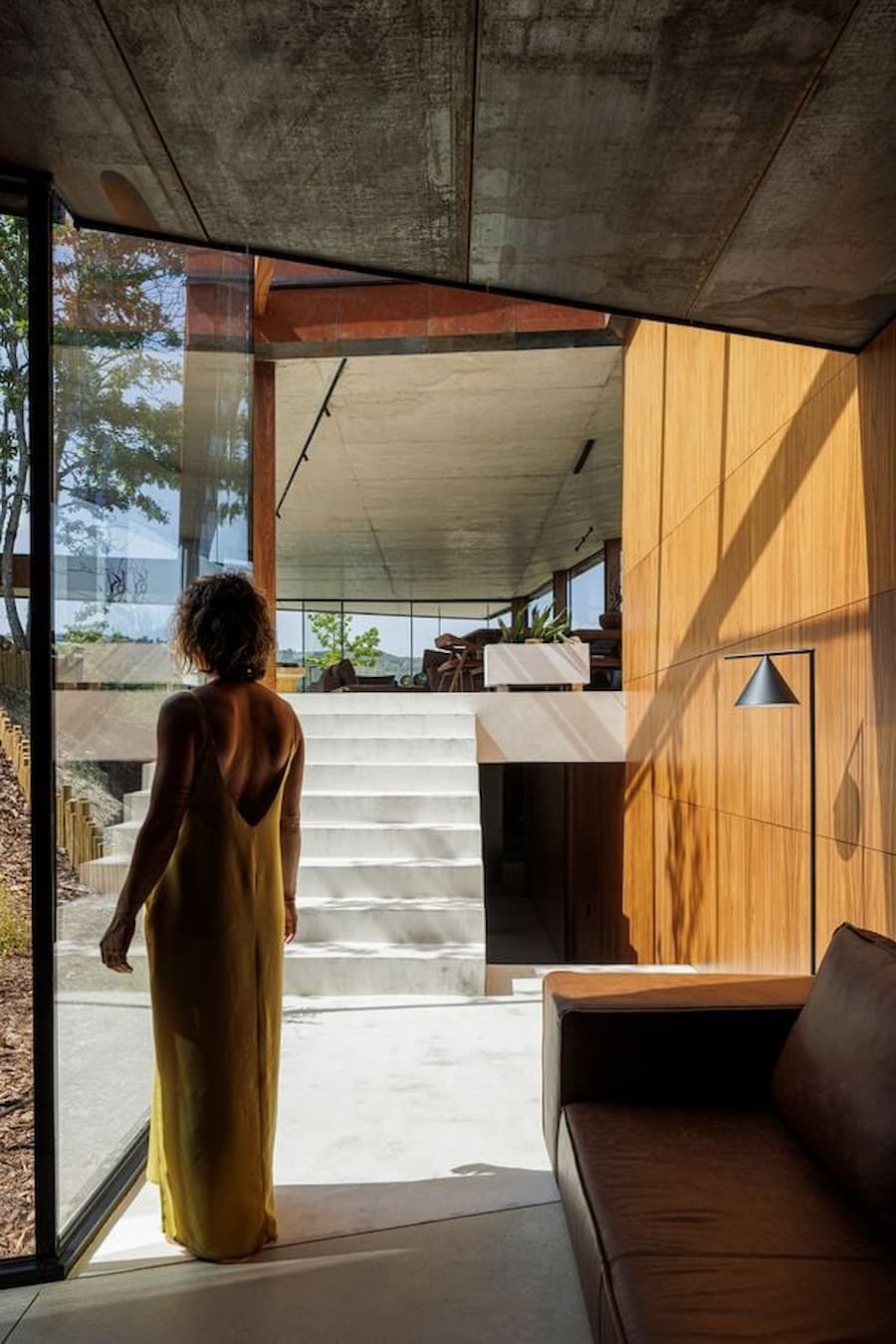 interior stair and light transition connecting levels within sloped house