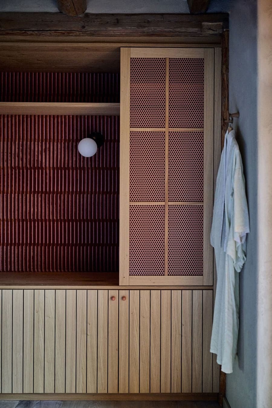 built in wooden cabinetry integrated with wall surface and structural frame