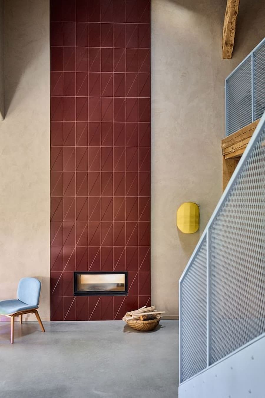 colored tile wall surface integrated with fireplace within interior space