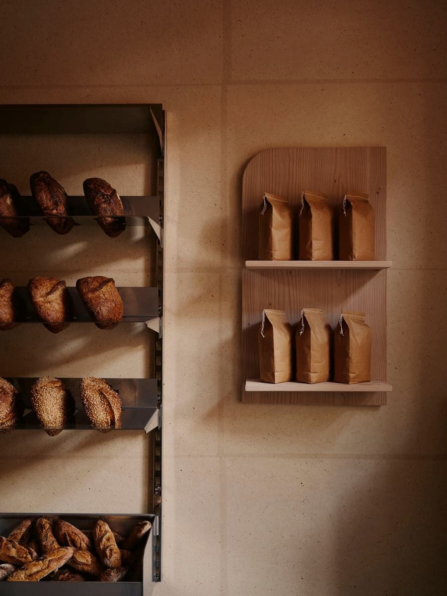 Bread display on wall shelf in KEIT bakery Berlin
