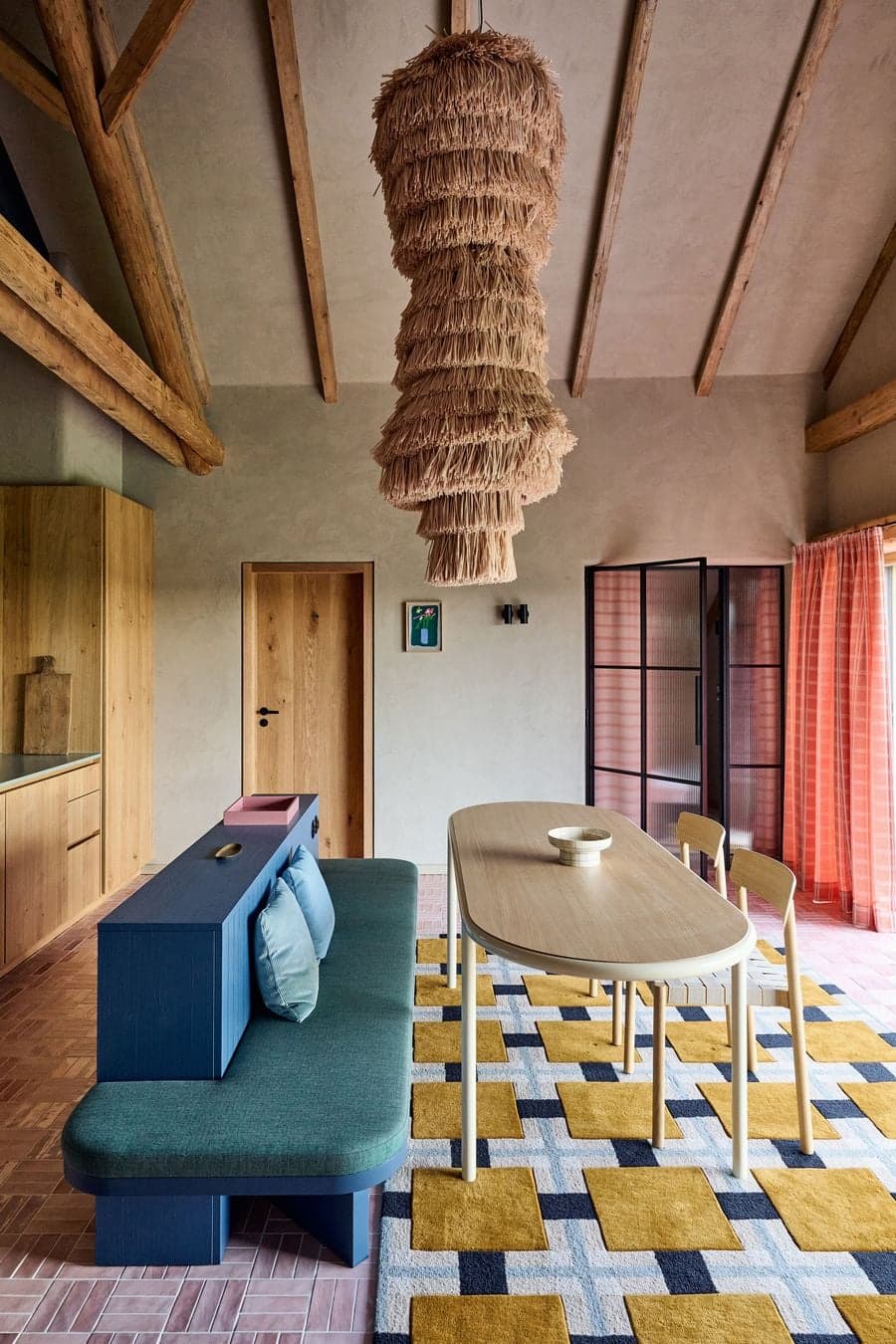 open living and dining space with mixed furniture and exposed timber structure