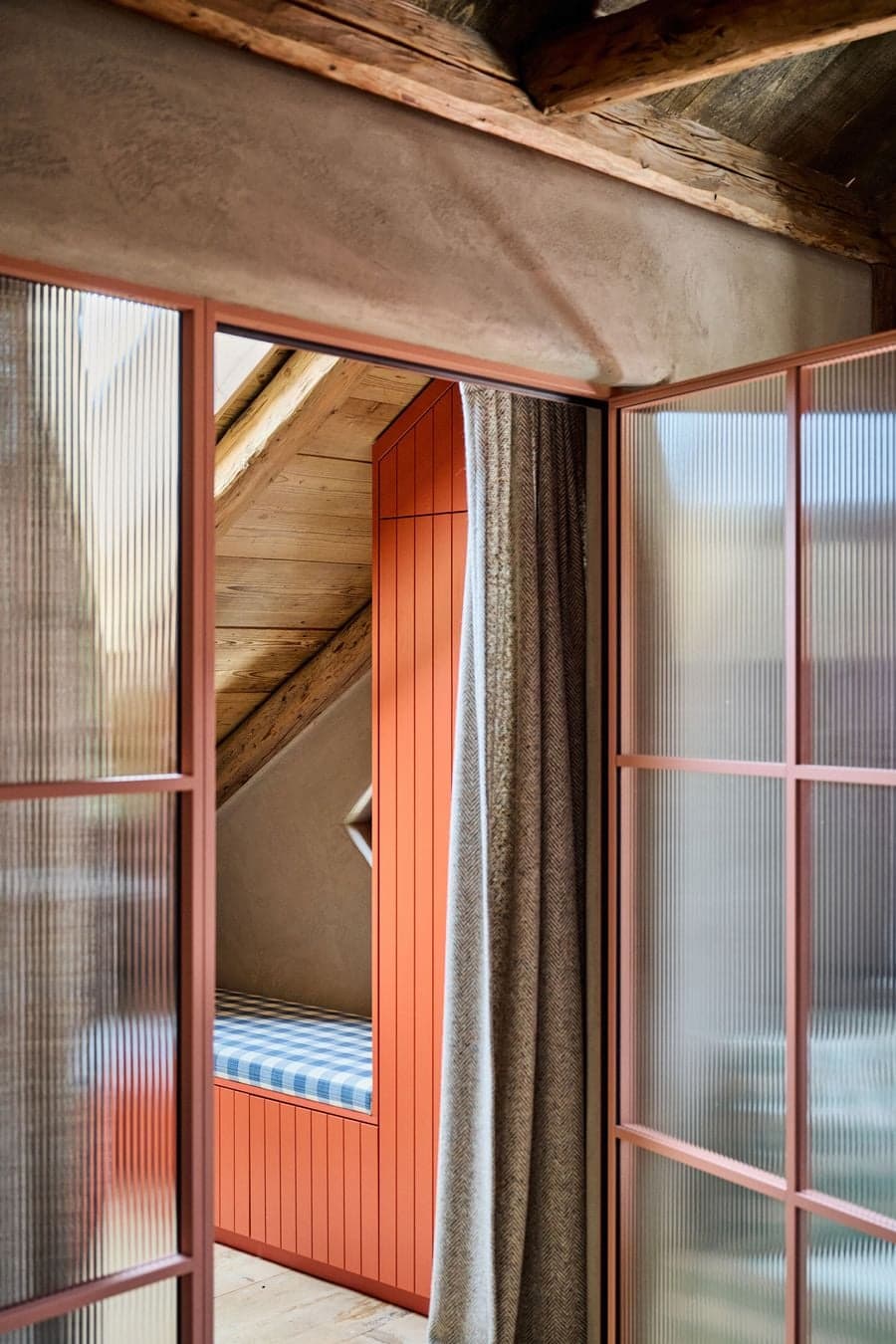 semi transparent partition separating sleeping area with layered materials