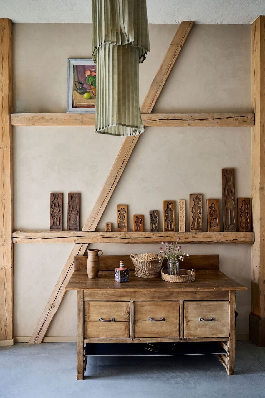 objects displayed on wooden shelf integrated within structural frame