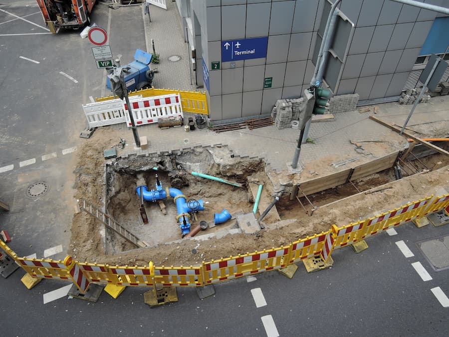 subsurface tunnel carved through earth representing infrastructure systems and movement of resources underground
