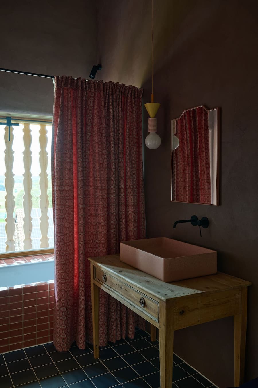 bathroom interior combining wood vanity curtain partition and earthy material palette