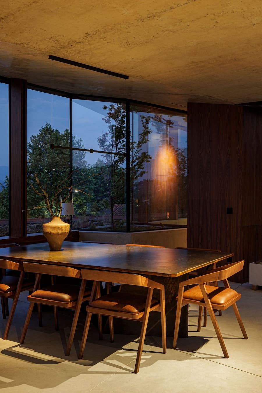 perforated metal screen filtering light and mediating visual permeability between layers