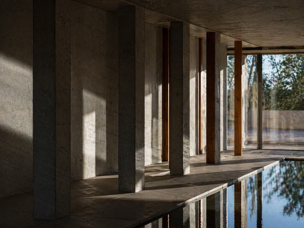 light shifting across column surfaces forming layered shadow