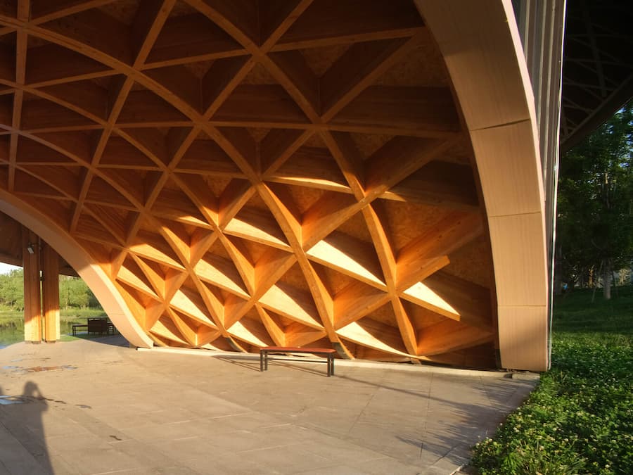 triangular timber roof grid system with structural joints and material texture