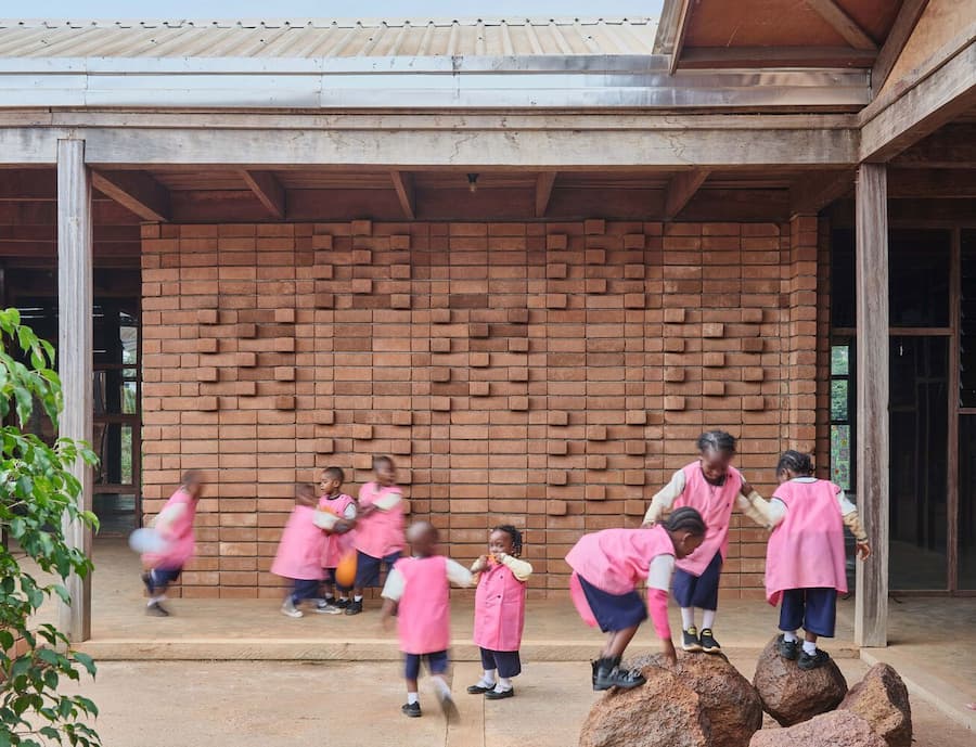 children interacting with tactile architectural space designed through natural materials and open learning environment