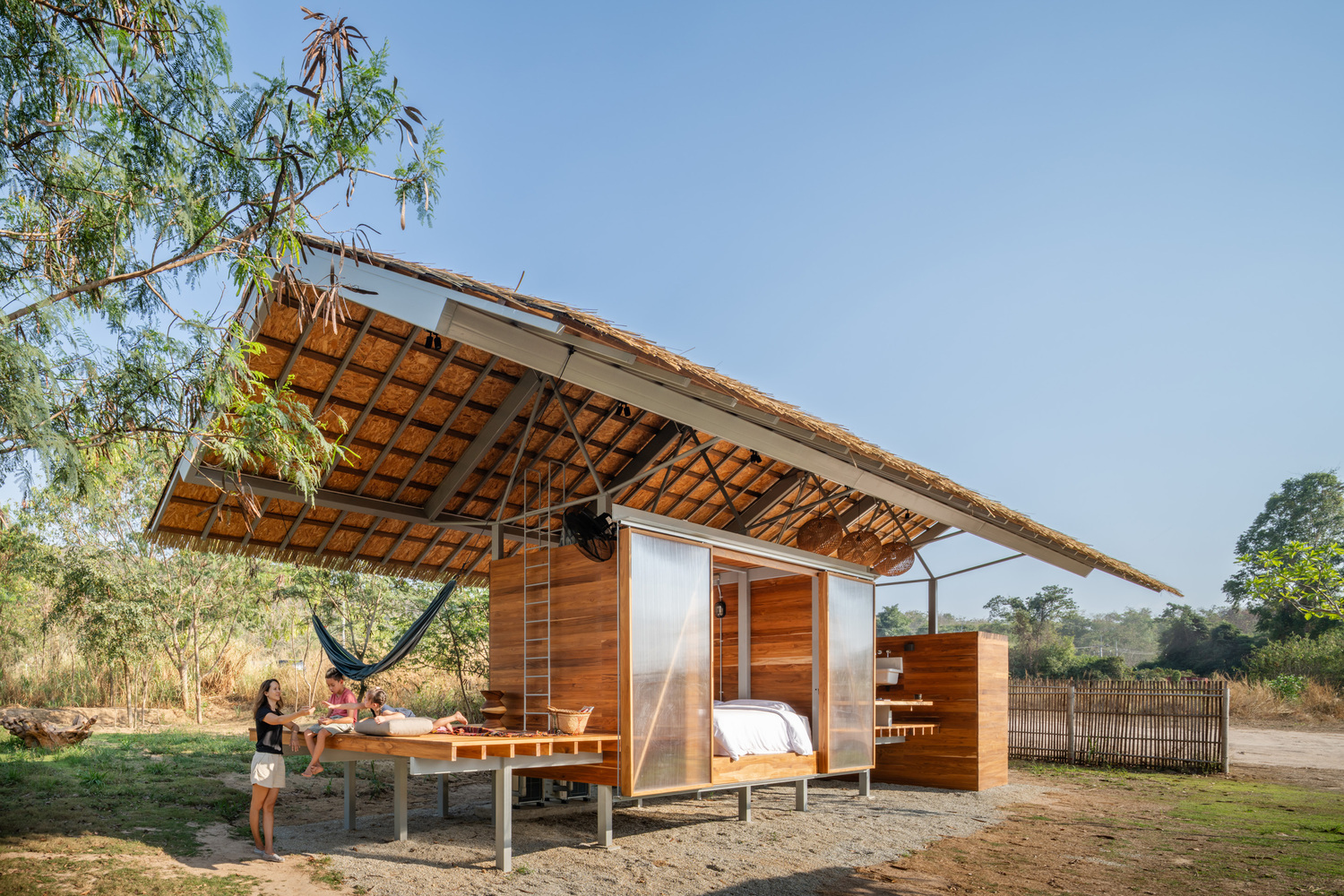 lightweight tropical dwelling combining elevated living platform and natural ventilation