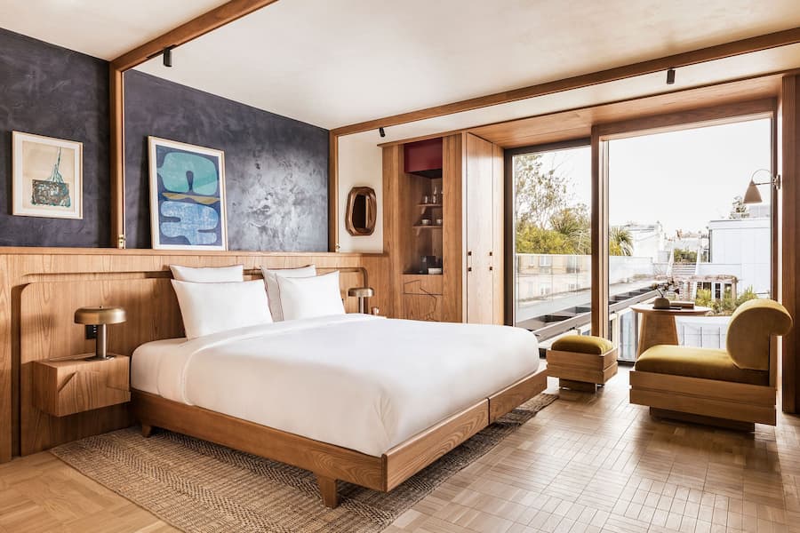 Hotel suite bedroom with terrace view at La Fondation in Paris