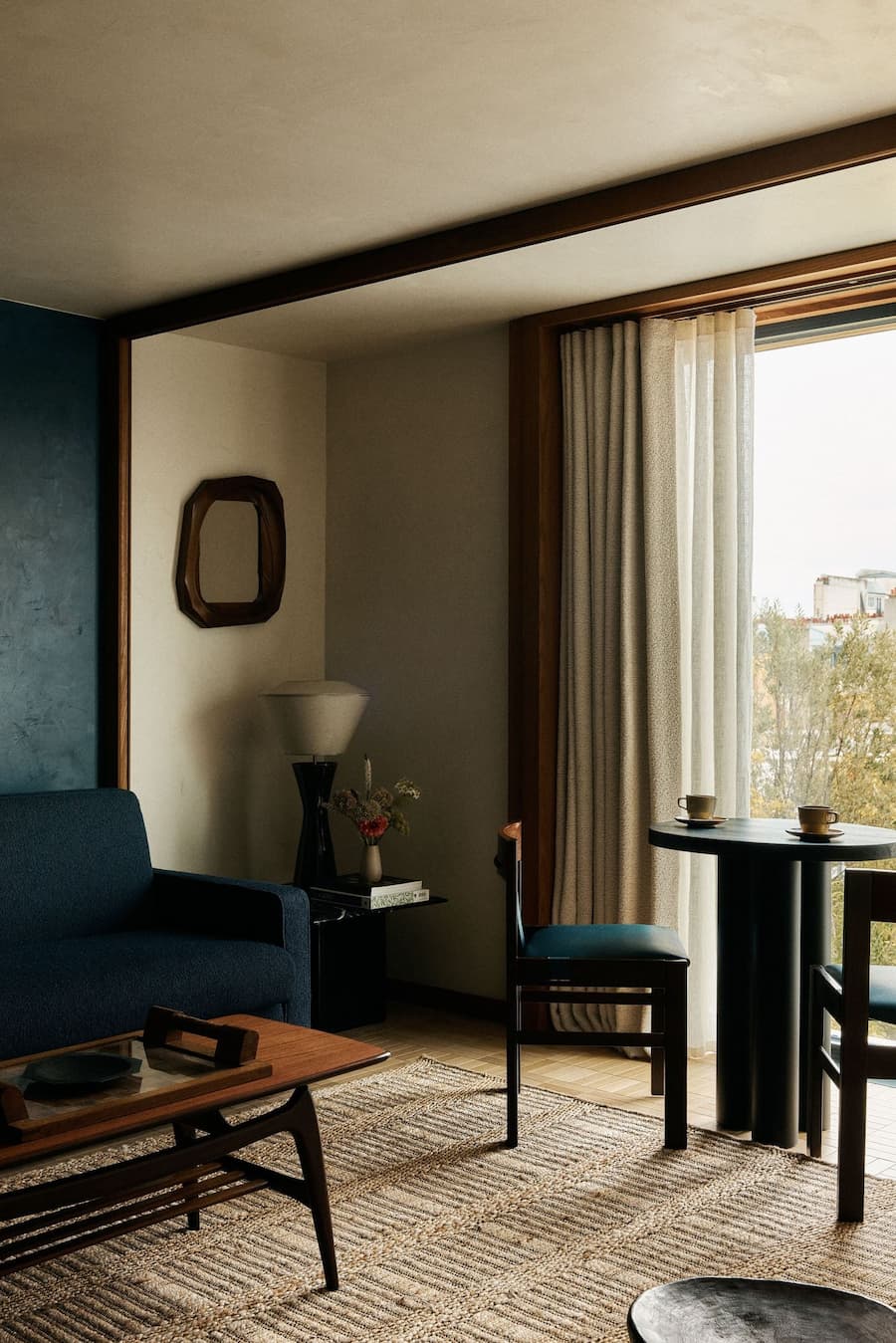 Lounge seating area with natural window light at La Fondation Paris