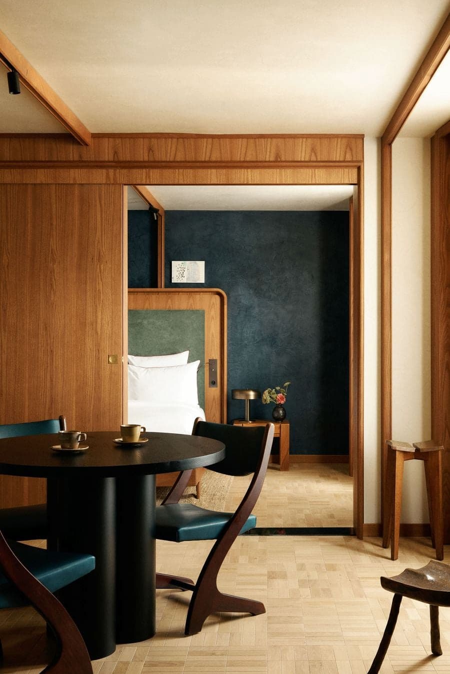 Integrated bedroom and dining space within La Fondation hotel suite