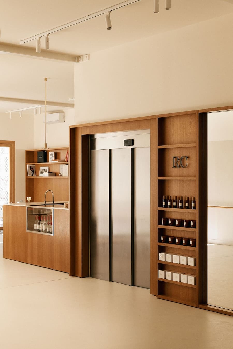 Contemporary retail space featuring custom timber joinery and integrated display shelving