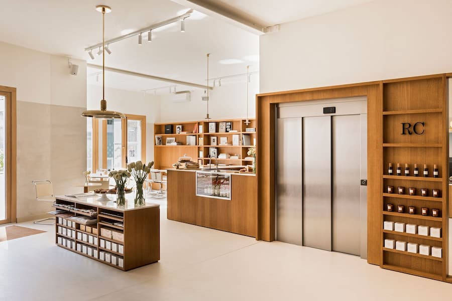 Boutique café interior with oak joinery, custom shelving and soft natural lighting