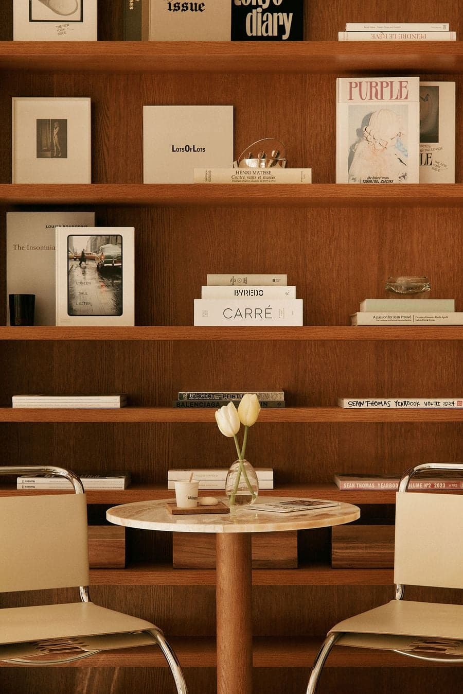 Hospitality juice bar with natural materials, warm oak cabinetry and minimalist styling