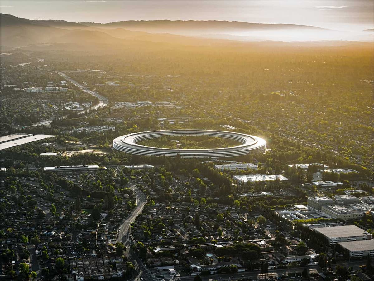 Apple architecture showcasing glass facades, natural light, and minimalist spatial design
