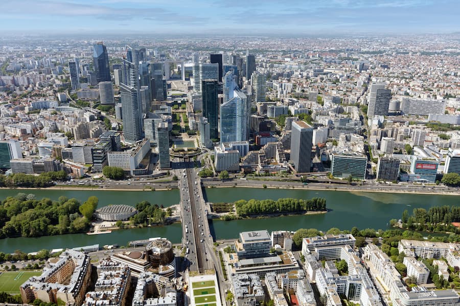 Aerial view of La Défense and the dense metropolitan fabric of Paris