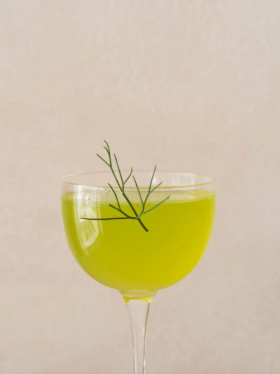 Signature herbal cocktail infused with Mediterranean botanicals served at YAPA Antiparos restaurant in Greece