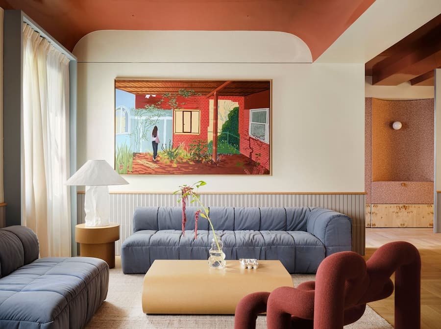 Curved sofas and contemporary artwork define the main living space of the Madrid villa.
