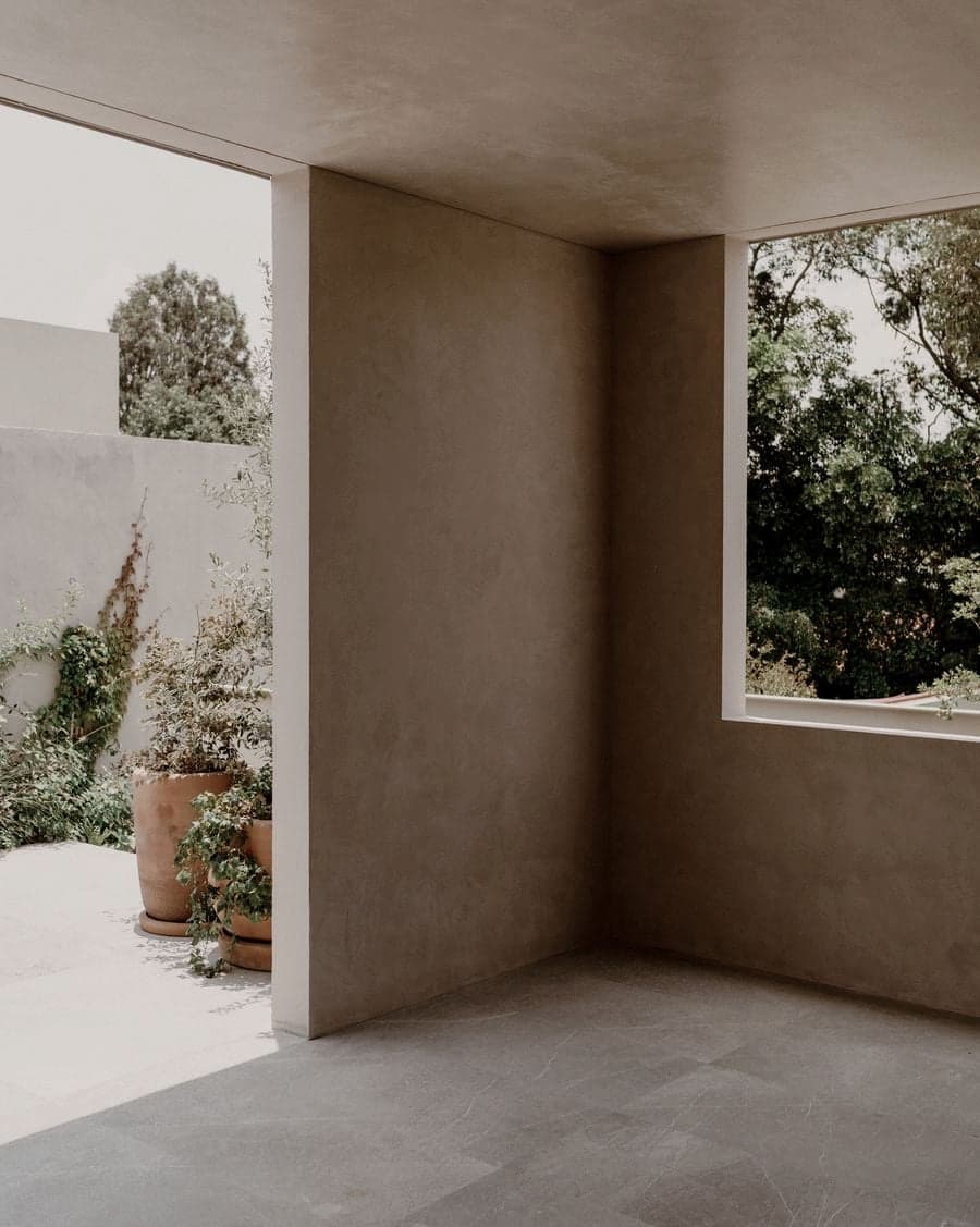 Covered outdoor passage connecting the entrance with the private garden at Barrancas House
