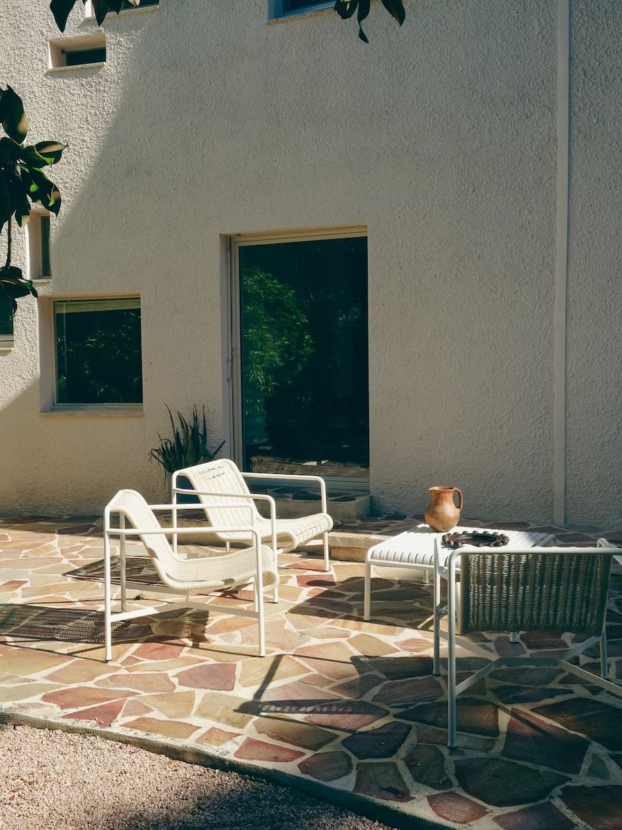 Stone terrace at Villa Bank furnished for outdoor living as part of the Casa Ideale hospitality concept