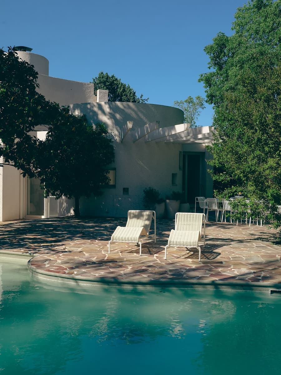 Poolside terrace at Villa Bank combining organic architecture, landscape and contemporary outdoor furniture