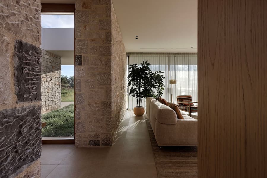 Stone-lined corridor connecting the entrance courtyard with the living area
