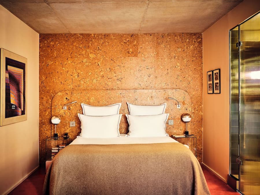 Guest room with cork headboard at Bus Palladium Hotel Paris by Studio KO