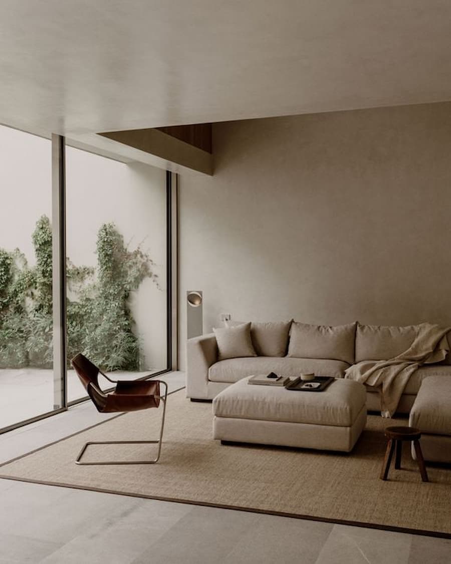 Corner seating area capturing uninterrupted views across the private courtyard