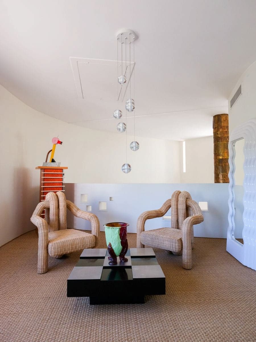 Upper-level view of Carla Sozzani photography exhibition integrated into the architecture of Villa Bank