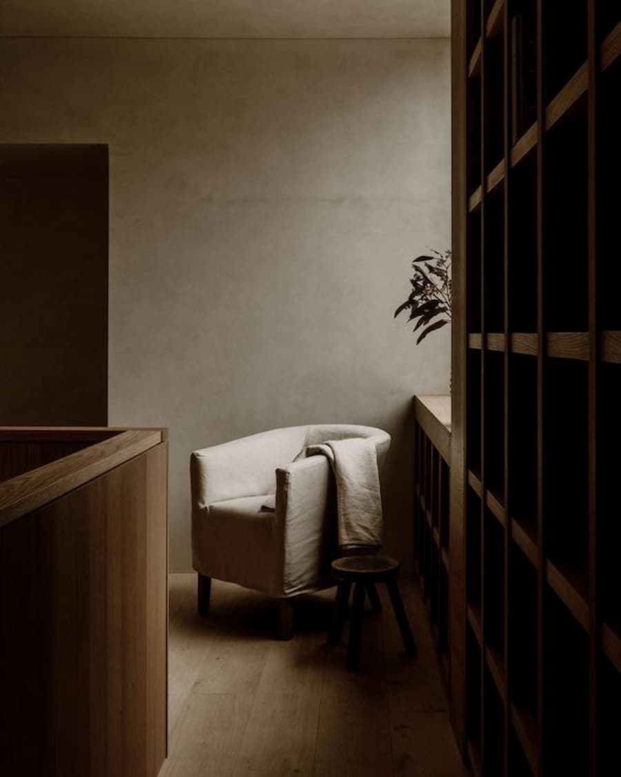 Reading nook framed by custom oak shelving and a large picture window