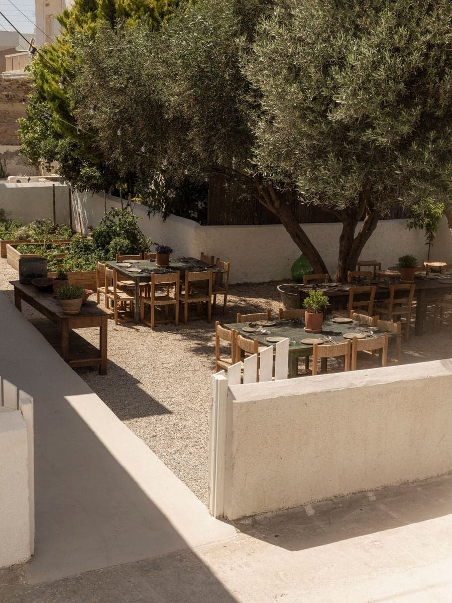 Garden dining entrance leading into the Mediterranean outdoor restaurant at YAPA Antiparos, Greece