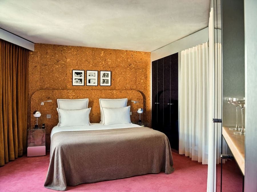Studio KO designed guest room featuring cork walls and warm-toned interiors in Paris