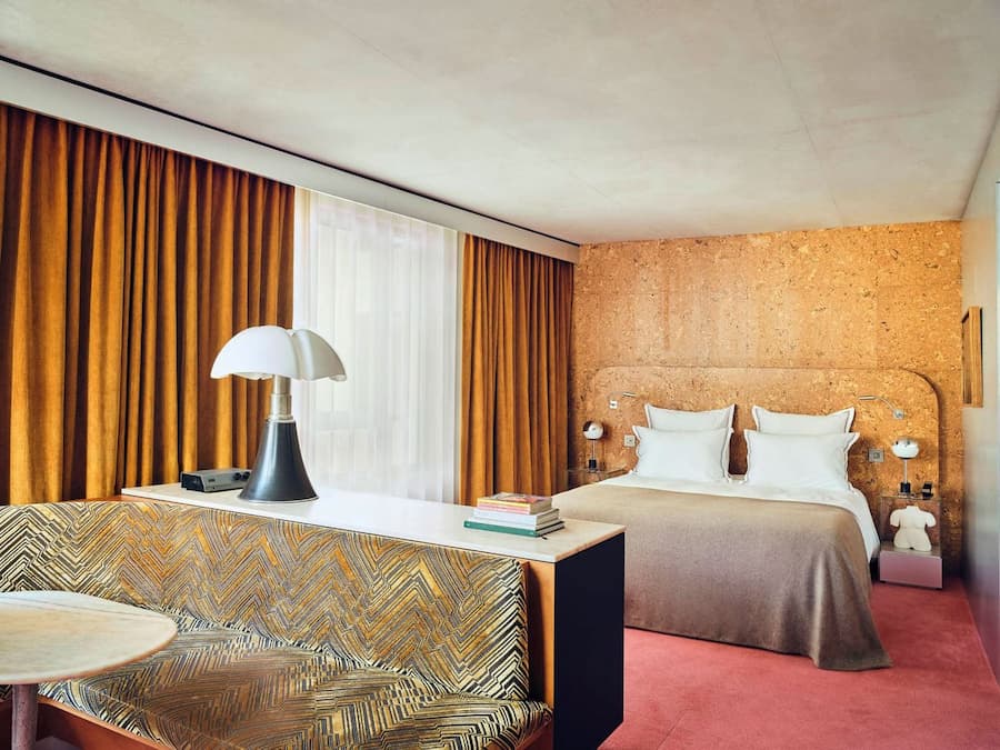 Boutique hotel suite blending retro furnishings with contemporary design at Bus Palladium Hotel Paris