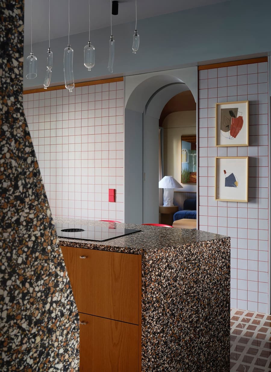 Bespoke terrazzo kitchen island showcases the layered material palette of the 1934 Madrid villa renovation.
