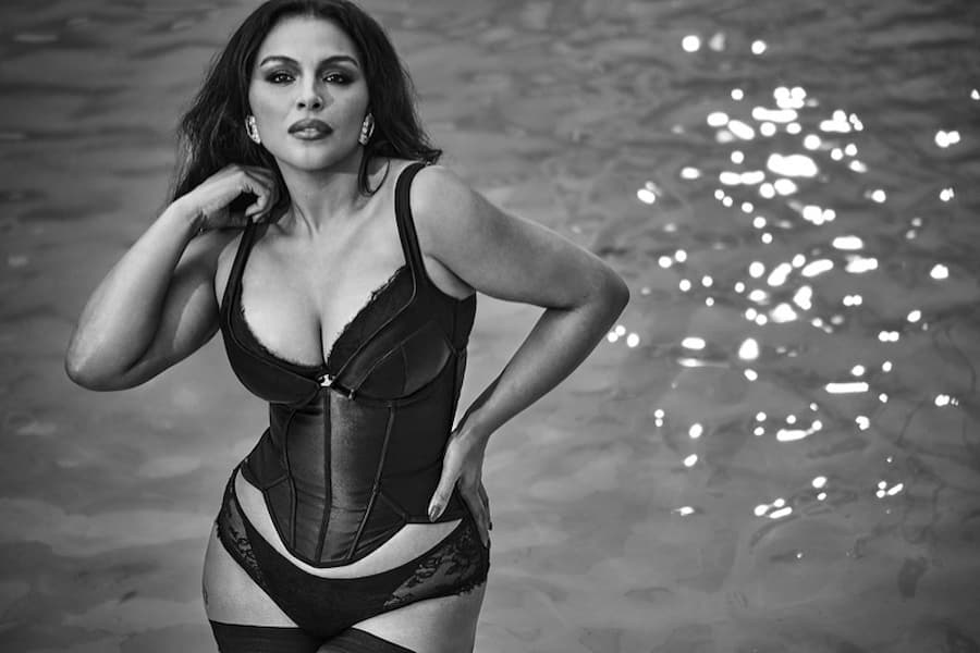 Anok Yai wearing a Victoria's Secret black lace bodysuit