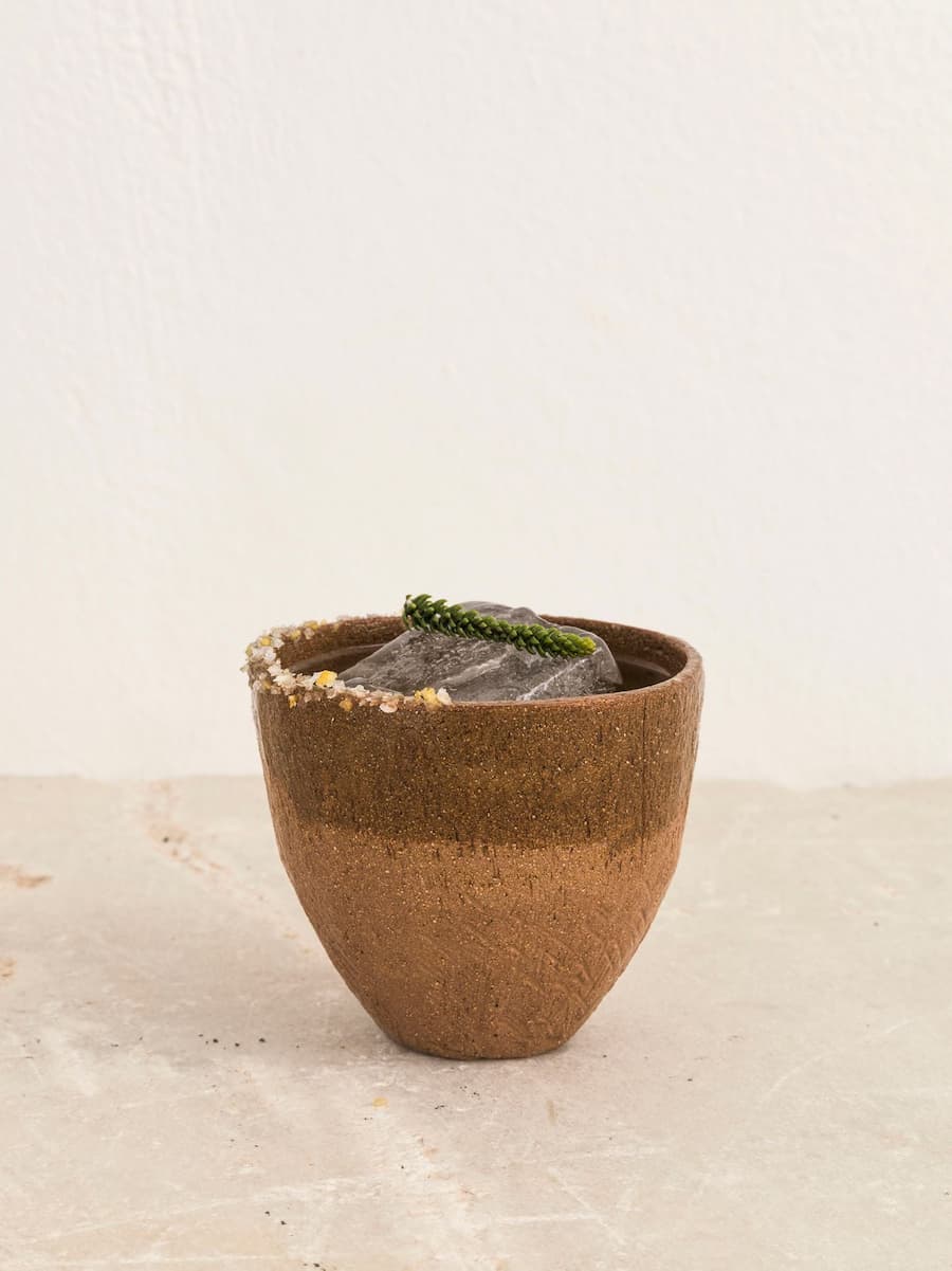 Signature cocktail served in a handcrafted ceramic cup at YAPA Antiparos, Greece