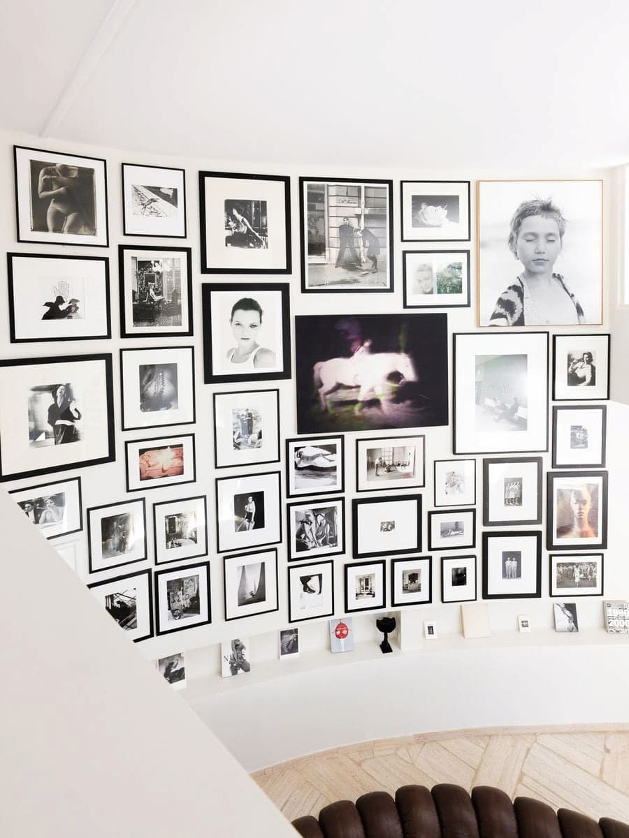 Photography installation from Carla Sozzani's private collection displayed throughout Casa Ideale at Villa Bank
