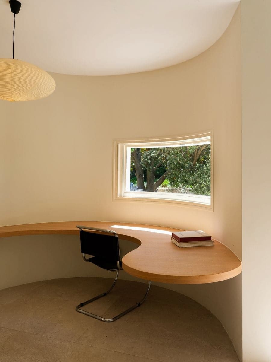 Curved study designed by Émile Sala overlooking the surrounding landscape at Villa Bank