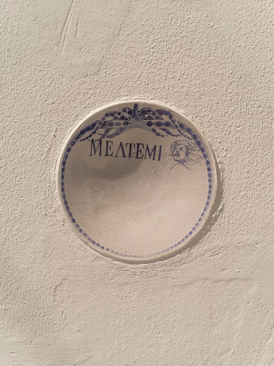 Handcrafted ceramic signage inspired by Cycladic craftsmanship at YAPA Antiparos, Greece