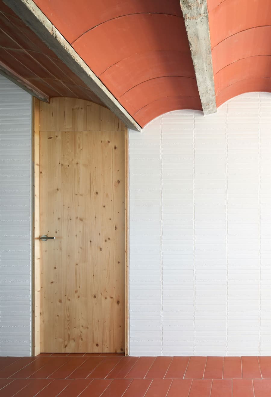 Detail of the original Catalan vaulted ceiling meeting pinewood joinery at Ca la Carolina.